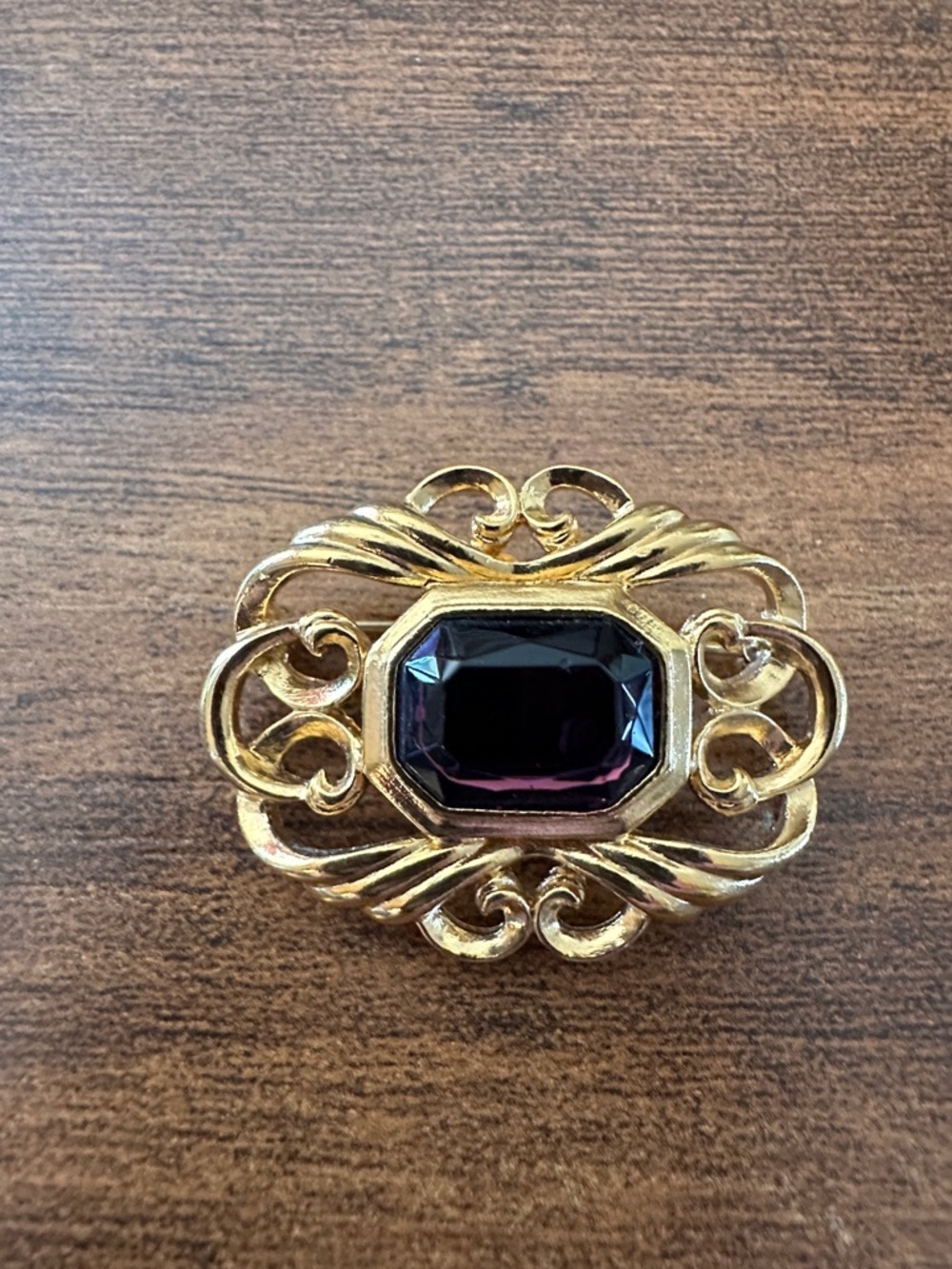 Gold-Tone Brooch with Deep Purple Center Stone